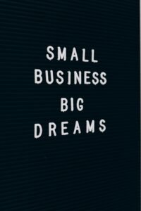Close-up of a motivational quote about small business dreams on a letter board.